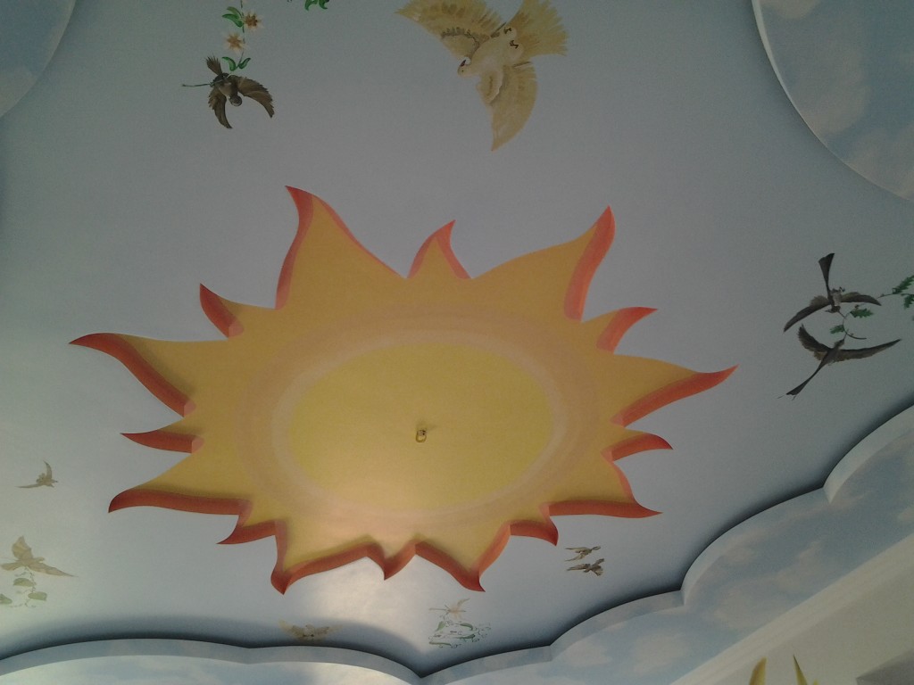 художественная роспись Солнце на стене